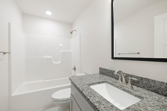 full bathroom with vanity, shower / tub combination, and toilet