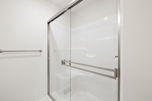 bathroom featuring an enclosed shower