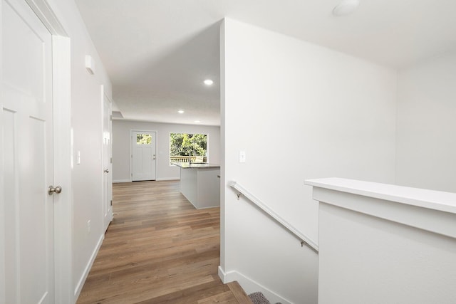 corridor featuring hardwood / wood-style floors