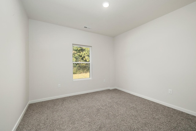 empty room with carpet flooring