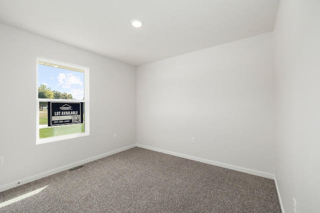 empty room featuring carpet floors