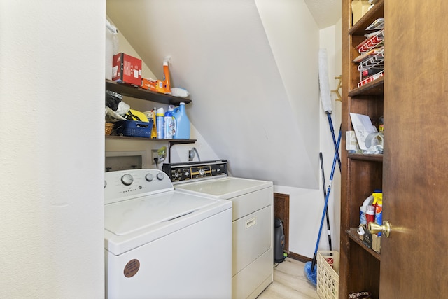 laundry area featuring light wood-type flooring and independent washer and dryer