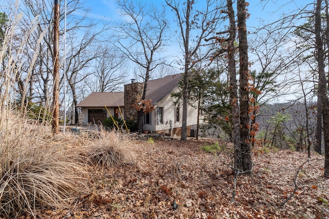 view of side of property with a garage