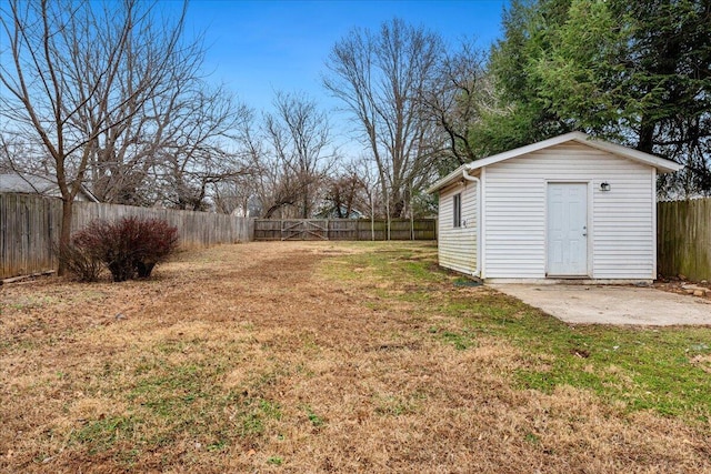 view of yard featuring a patio and an outdoor structure