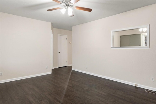 unfurnished room featuring dark hardwood / wood-style flooring and ceiling fan