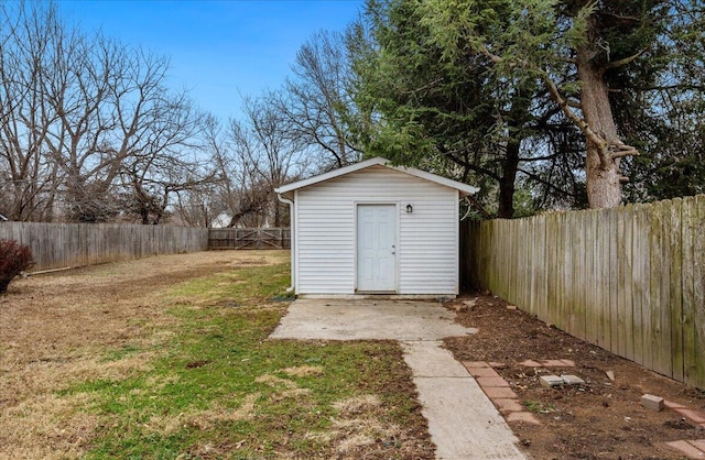 view of outdoor structure featuring a lawn