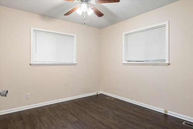 spare room with wood-type flooring and ceiling fan