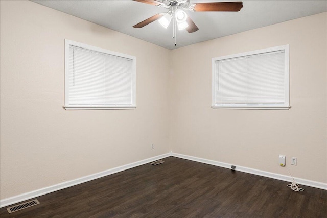 spare room featuring wood-type flooring and ceiling fan