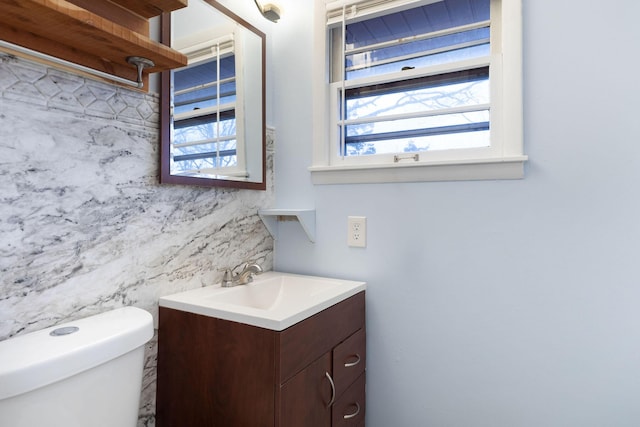 bathroom with vanity and toilet