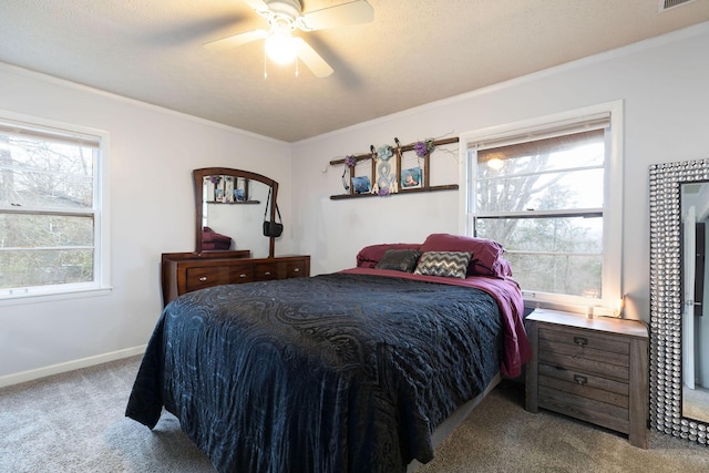 carpeted bedroom featuring multiple windows, crown molding, and ceiling fan