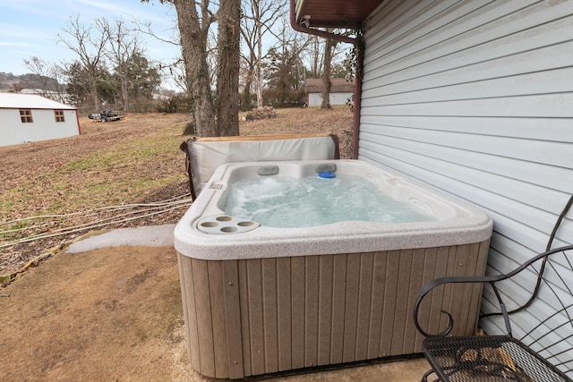 view of patio with cooling unit and a hot tub