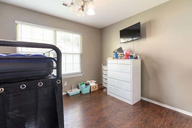 130 A St, Taneyville, MO 65759 - bedroom with an inviting chandelier and dark wood-type flooring