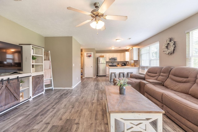 130 A St, Taneyville, MO 65759 - living room featuring hardwood / wood-style floors and ceiling fan