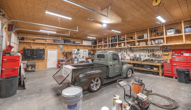 garage featuring a workshop area