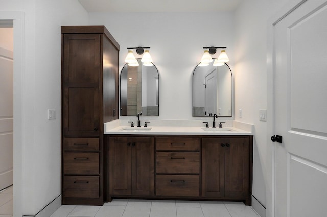 bathroom with tile patterned floors and vanity