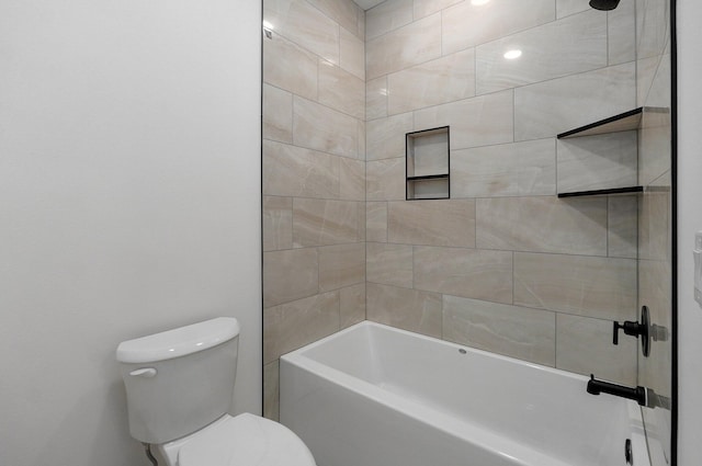 bathroom with toilet and tiled shower / bath combo