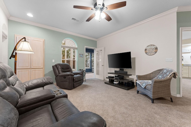 living room featuring crown molding, ceiling fan, and carpet flooring