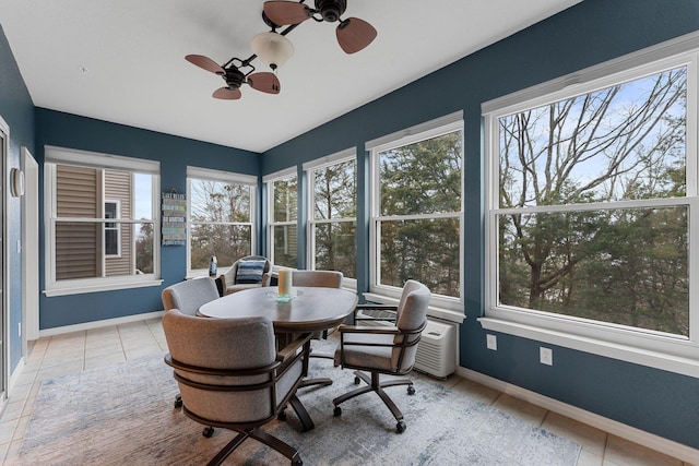 sunroom with ceiling fan