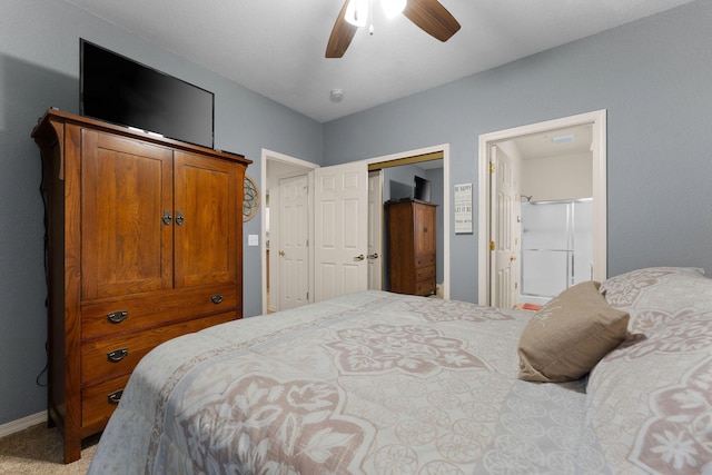 bedroom featuring ceiling fan, carpet flooring, a closet, and ensuite bath