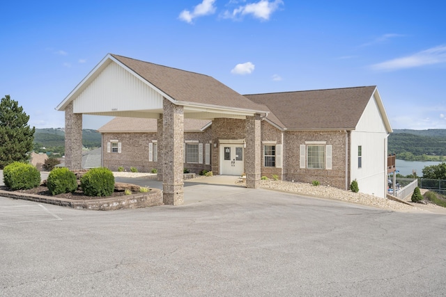 view of front of house featuring a water view