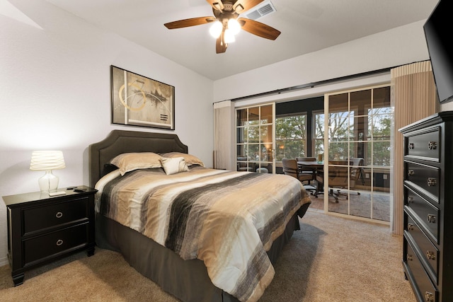 bedroom featuring light colored carpet, access to exterior, and ceiling fan