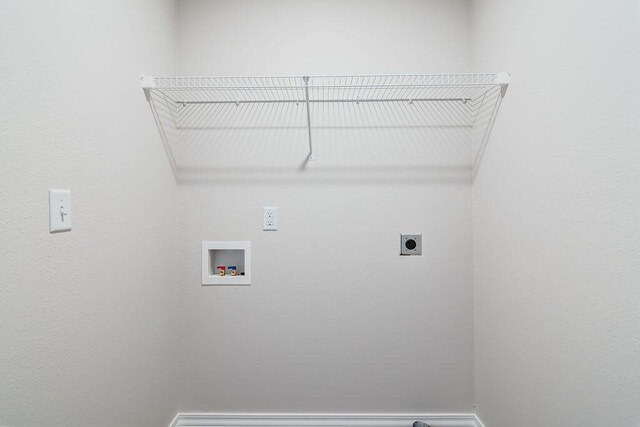 laundry room featuring electric dryer hookup and washer hookup