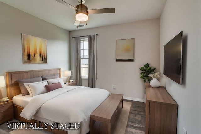 bedroom with ceiling fan and dark hardwood / wood-style flooring