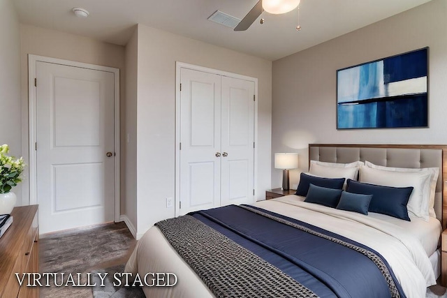 bedroom with ceiling fan, dark hardwood / wood-style flooring, and a closet