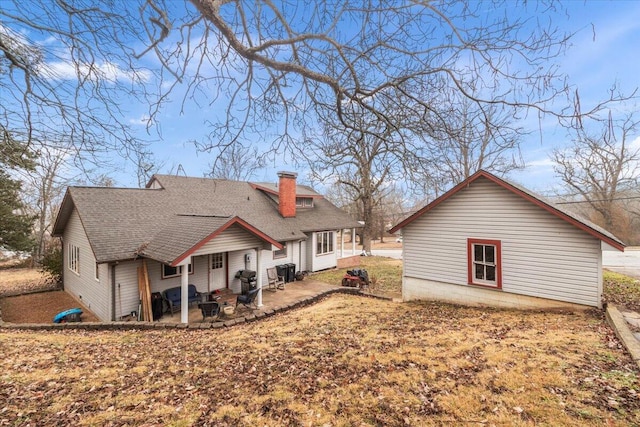 rear view of property featuring a patio area