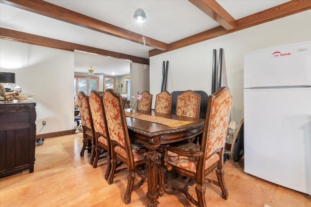 dining room with beam ceiling and light hardwood / wood-style flooring