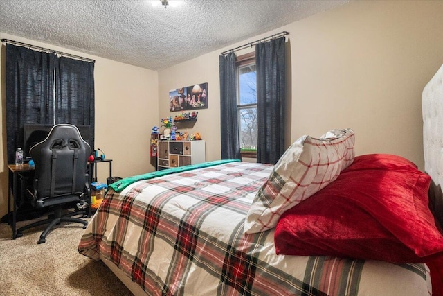bedroom with carpet floors and a textured ceiling