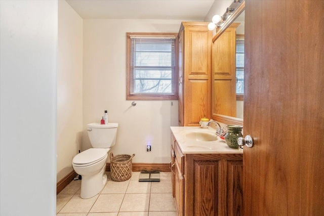 bathroom featuring tile patterned flooring, vanity, and toilet