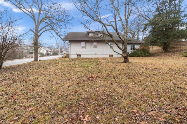 view of home's exterior featuring a yard