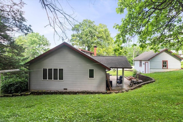 433 S Hill St, West Plains, MO 65775 - back of house with a lawn, a patio area, and crawl space