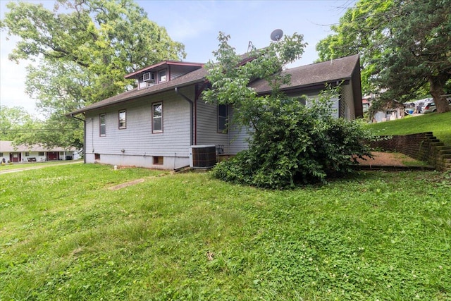 433 S Hill St, West Plains, MO 65775 - rear view of house featuring central air condition unit and a lawn