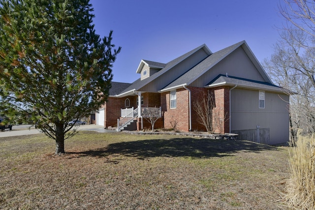 view of front of property with a porch and a front yard