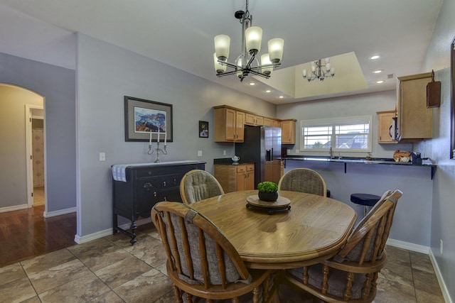 dining room with a notable chandelier