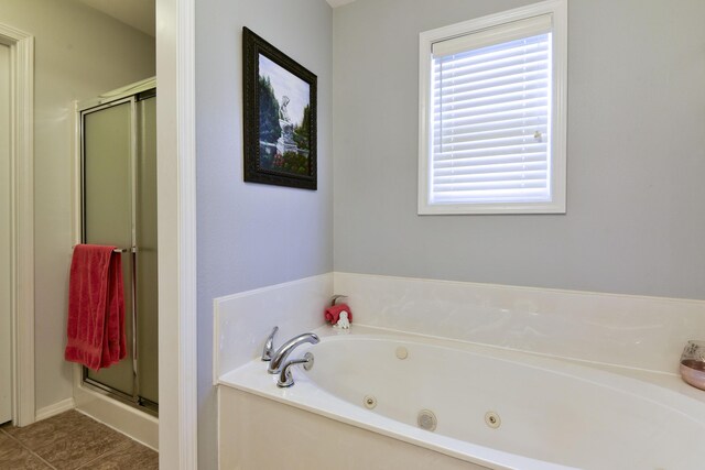 bathroom with tile patterned flooring and plus walk in shower