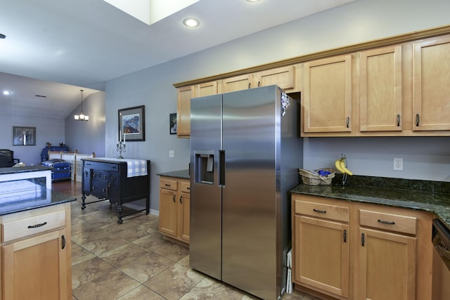 kitchen featuring decorative light fixtures, stainless steel appliances, and light brown cabinets