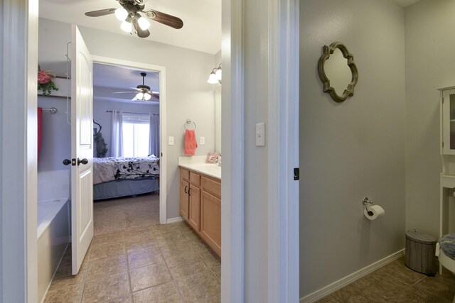 bathroom featuring vanity and ceiling fan