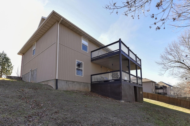 rear view of house featuring a balcony