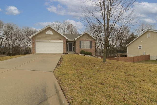 view of front facade featuring a garage and a front lawn