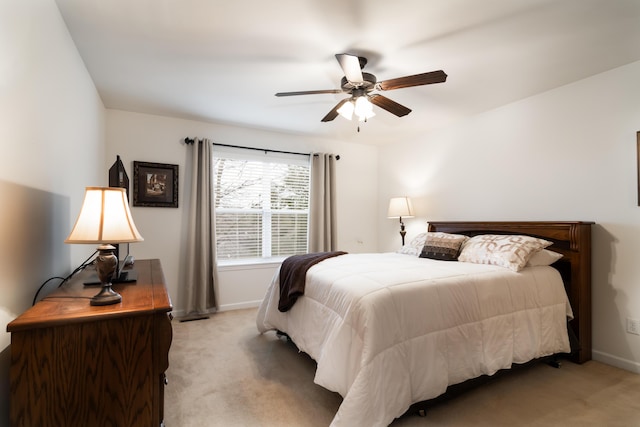 bedroom featuring ceiling fan and light colored carpet