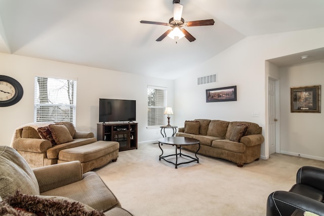 carpeted living room with lofted ceiling and ceiling fan