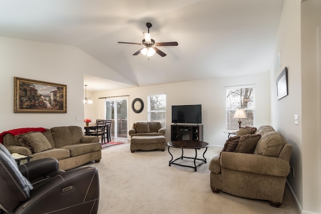 carpeted living room featuring vaulted ceiling and ceiling fan