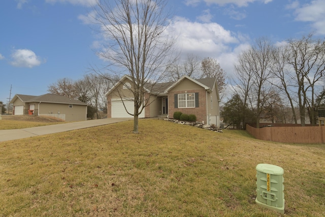 ranch-style house featuring a garage and a front yard