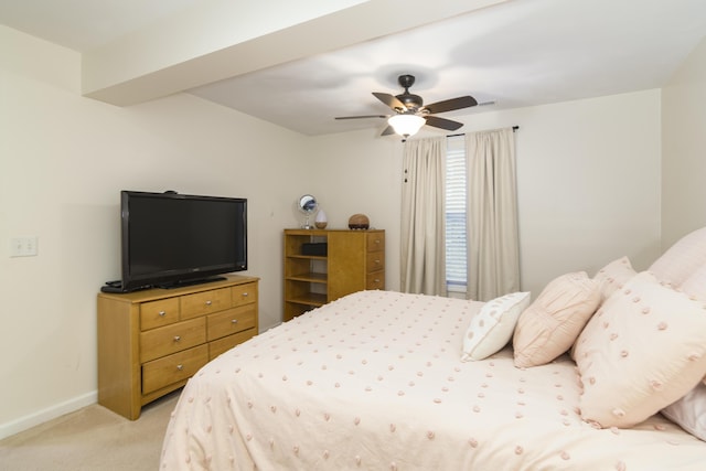 bedroom featuring light colored carpet and ceiling fan