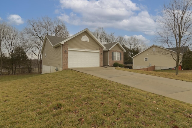 view of front of home with a garage and a front yard