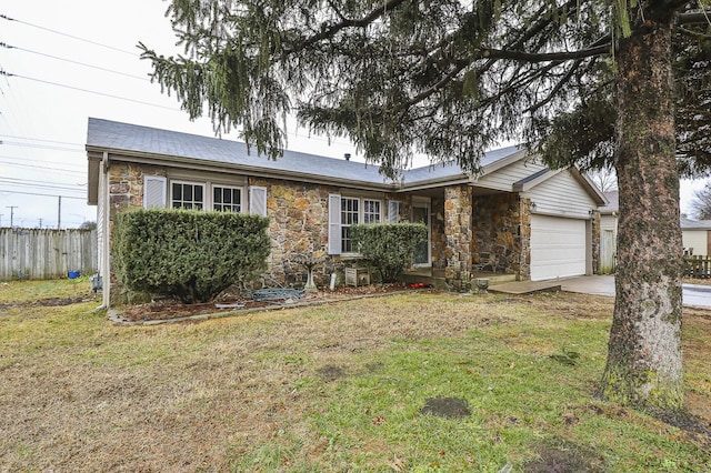 ranch-style house with a garage and a front lawn