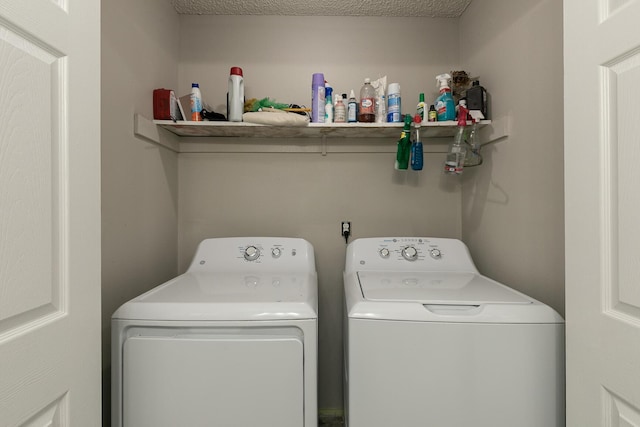 clothes washing area featuring washing machine and clothes dryer